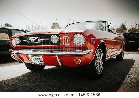 MALAGA, SPAIN - JULY 30, 2016: 1966 Ford Mustang front view in red color, parked in Malaga, Spain.