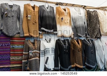 Pisac Peru - May 15: Beautiful sweaters made with alpaca and llama hair for sale in the Pisac market. May 15 2016 Pisac Peru.