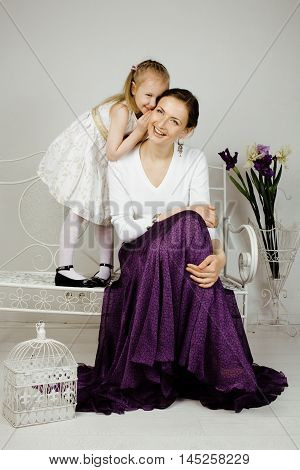 young mother with daughter at luxury home interior vintage, old fashion relashionship family