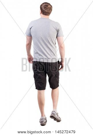 Back view of walking handsome man in shorts and sneakers.   Sports-dressed young man moves. going young guy. Rear view people collection.  backside view of person.  Isolated over white background