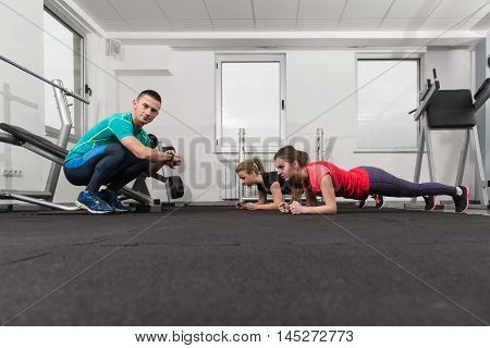 People Stretching During Fitness Class In Fitness Center