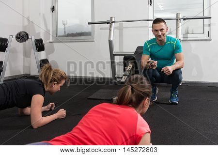 Group Of Sportive People In A Gym Training