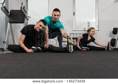 Gym People Stretching And Looking Very Happy