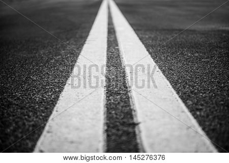 Asphalt highway with white road markings lines background