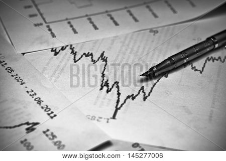 stock market graph with a pen. Business concept photo.