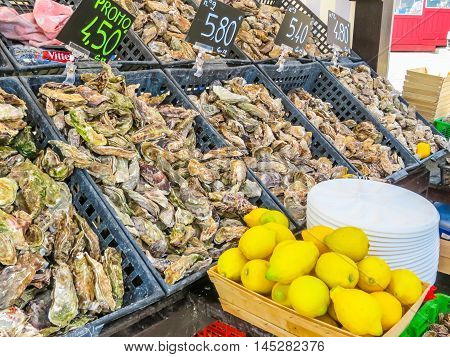 CANCALE, FRANCE -MAY 03, 2014: Fresh oysters in oyster market, Cancale, France