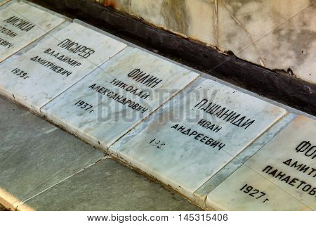 GELENDZHIK, RUSSIA - NOVEMBER 6, 2015: Plates with names of monument to fallen sailors of crew of seiner Toporok in Feb 6 1966 at sea in storm. On memorial there is names of all dead fishermen on November 6, 2015 in city-resort Gelendzhik, Russia