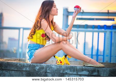 Bangkok, Thailand – August 24,2016:  Trainer  Girl   Playing Pokemon , Pokemon Ball