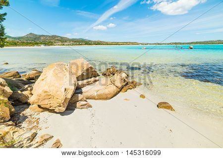 rocks and sand in Lu Impostu beach Sardinia