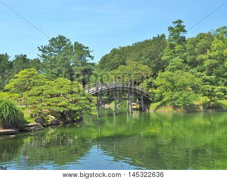 A wooden bridge - Engetsukyo in Ritsurin Garden in Takamatsu city, Kagawa Prefecture, Japan. Ritsurin Garden is one of the most famous historical gardens in Japan.