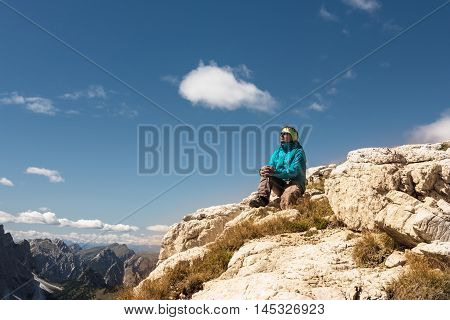 sport women on the top of mountain