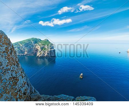 beautiful rocks in Capo Caccia bay with Foradada island on the background