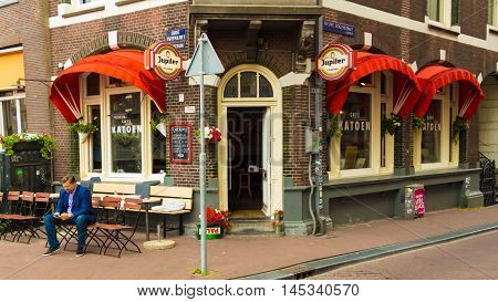 Amsterdam the Netherlands-July 27 2016: The traditional Dutch cafe Katoen located at Turfmarkt in Amsterdam the Netherlands.