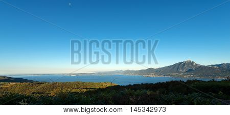 Lago di Garda (Garda Lake) the largest Italian lake of glacial origin. The Veneto coastline in the foreground in the background the coast of Lombardy