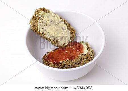 An alternative breakfast snack or a cheap dessert! Wheat cereal biscuits with low-fat spread (or butter) and jam. Tasty!