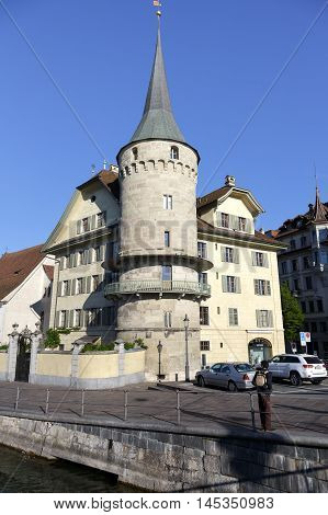 LUCERNE SWITZERLAND - MAY 5 2016: Haus zur Gilgen one of the oldest stone houses in the city and is located on the right bank of the river Reuss.