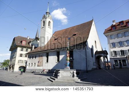 LUCERNE SWITZERLAND - MAY 04 2016: St. Peter Chapel (St. Peterskapelle) is located in the Chapel square (Kapellplatz) in old town