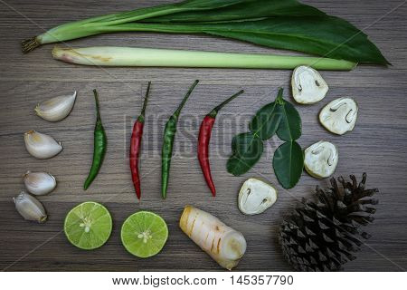 Fresh herbs and spices on wooden background Ingredients of Thai spicy food Ingredients of Tom yum Still life photography with ingredients The art of food photography with the ingredients