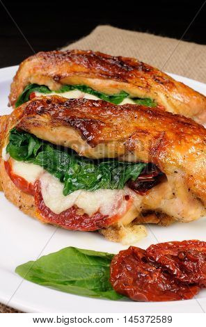 Baked chicken breast stuffed with mozzarella spinach sun-dried tomatoes