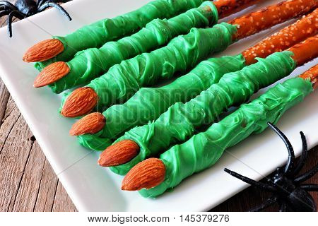 Spooky Halloween Witches Finger, Candy Dipped Pretzel Rods, Close Up On Plate