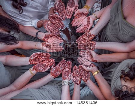 Beautiful Henna Or Mehendi Decoration On A Hindu Bride's And Her Friends Hand