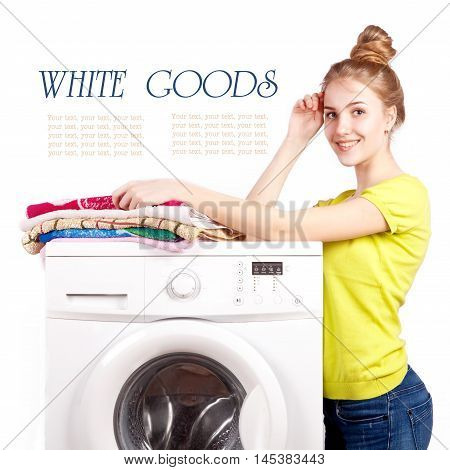 Beautiful happy girl leaning on the washing machine on a white background