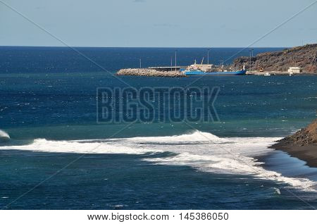 Waves Crashing Near Port