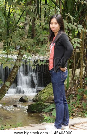 Thai woman with Mae Kam Pong waterfall, Chiangmai Thailand