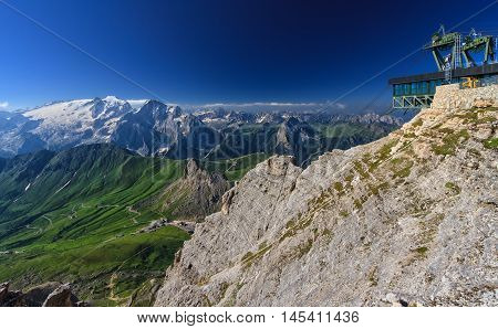 Dolomiti - aerial view of Pordoi pass from Sass pordoi mount. On background Mount Marmolada