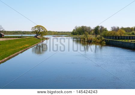 Small river Pakalne reflects blue sky rusne island lithuania