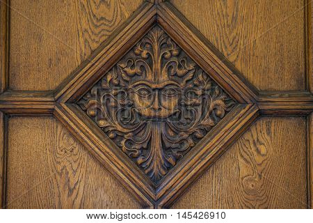 A beautiful carved door to Brasenose College in Oxford. The design a maned lion-like face is said to be an inspiration behind the famous CS Lewis book - The Lion The Witch and the Wardrobe.