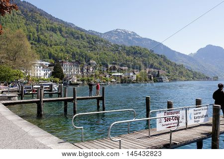 WEGGIS SWITZERLAND - MAY 05 2016: Wooden piers on the waterfront emphasize the tourist nature of the town on the shores of Lake Lucerne that provides many tourist attractions