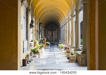 BOLOGNA,ITALY-DECEMBER 7,2016:Arcade inside the monumental cemetery of the Certosa di Bologna during a sunny day.