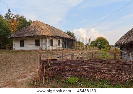 Old house of the peasants and the fence at the Museum of Pirogovo. Ukraine