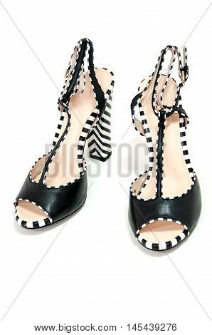 Pair Of Female High Heeled Slingbacks With Striped Heels.