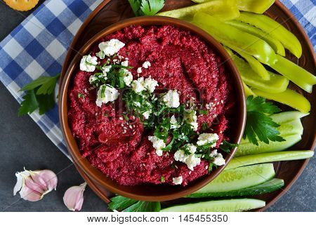 Appetizer of chickpeas - hummus with beetroot vegetables and feta