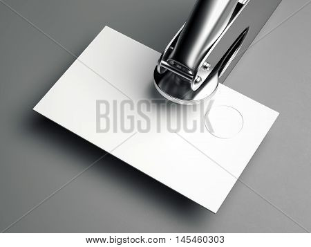 Metal embosser with blank business card on gray floor. 3d rendering