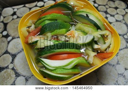 appetizing, bright colorful vegetable mix sqaush cut on slices, tomato, pepper light snack