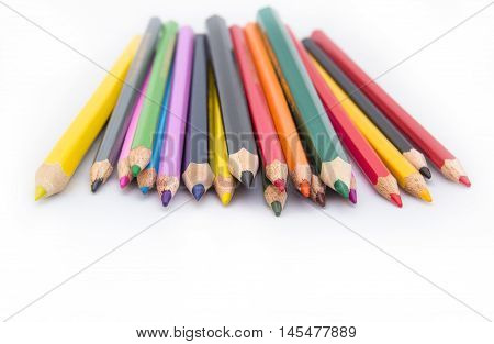 Drawing supplies: assorted color pencils. Сolored pencils on white background