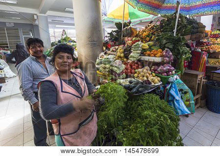 Píllaro ECUADOR - FEBRUARY 6 2016: Unidentified couple sells vegetables in the market Pillaro.