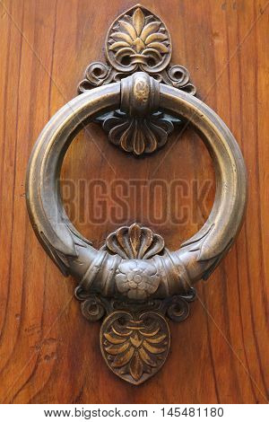 Old and ancient knocker in the city of Rome