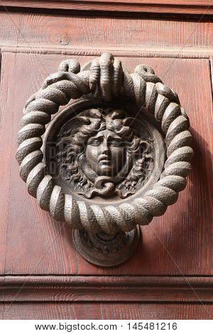 Old and ancient knocker in the city of Rome