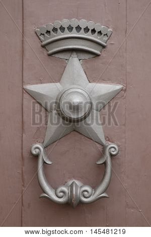 Old and ancient knocker in the city of Rome