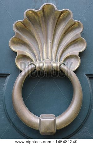 Old and ancient knocker in the city of Rome