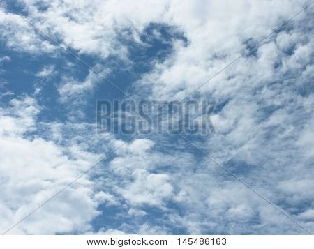White clouds on blue sky. Sky with clouds. The clouds in the sky. Clouds background. Sky background.