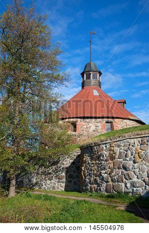 At the old foot of the medieval round tower of Lars Torstensson sunny october day. Korela Fortress Priozersk. Russia