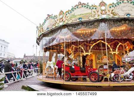 Helsinki Finland 21 December 2015 - Traditional Carousel at Christmas Market on Senat Square in motion