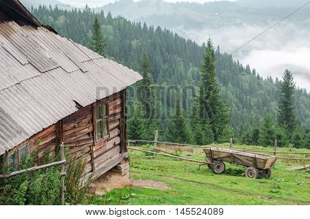 Old wooden house in mountain. cheese dairy. Carpathians Ukraine