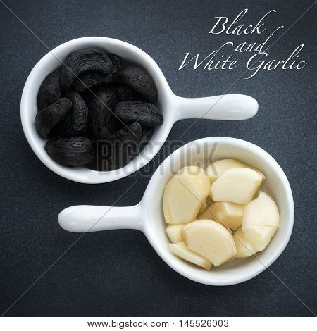Square macro image of Black and white Garlic in small white pots on a grey slate base with wording. ideal for pinterest