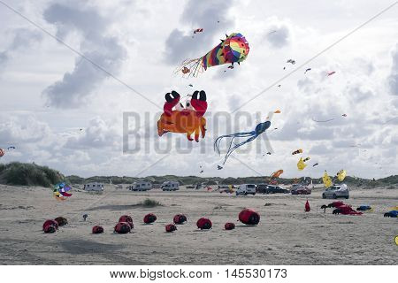 LAKOLK DENMARK - SEPTEMBER 3 2016: Colorful kites on the big beach on Lakolk Romo. International Kite Festival for the 27th time. September 3 2016.